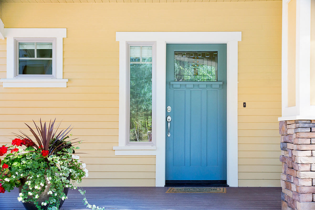 A teal coloured front door.