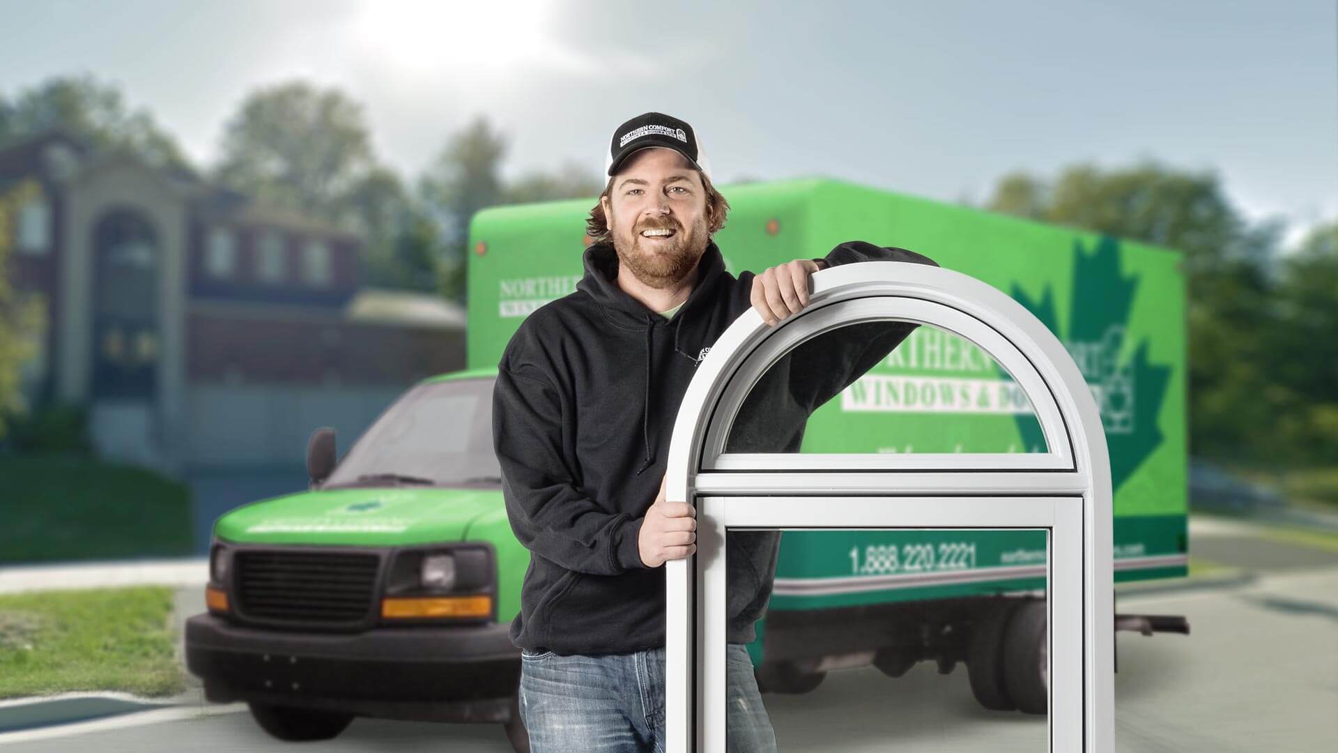 A Northern Comfort installer standing in front of a truck.