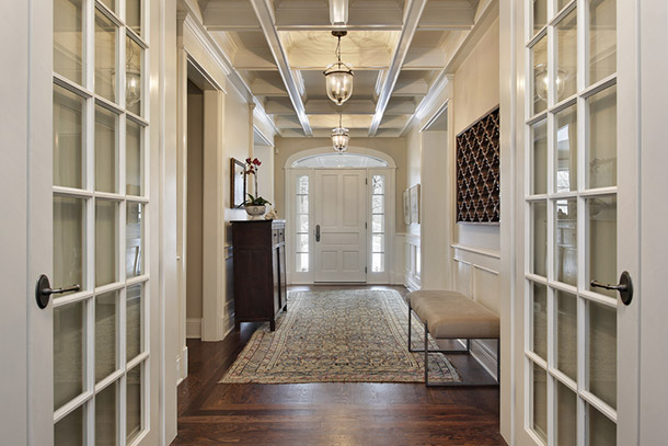 A photo of French doors opened leading into a hallway