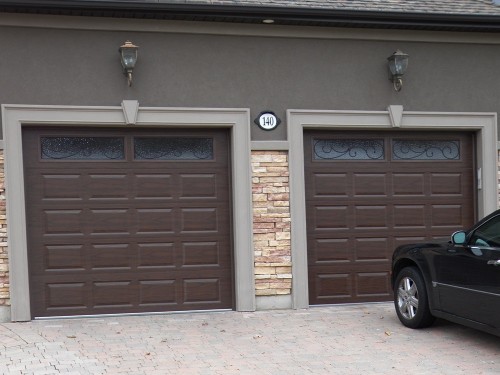 two single car brown garage doors