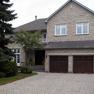 home with two carriage style garage doors