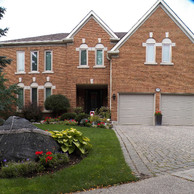 two car garage home with small windows