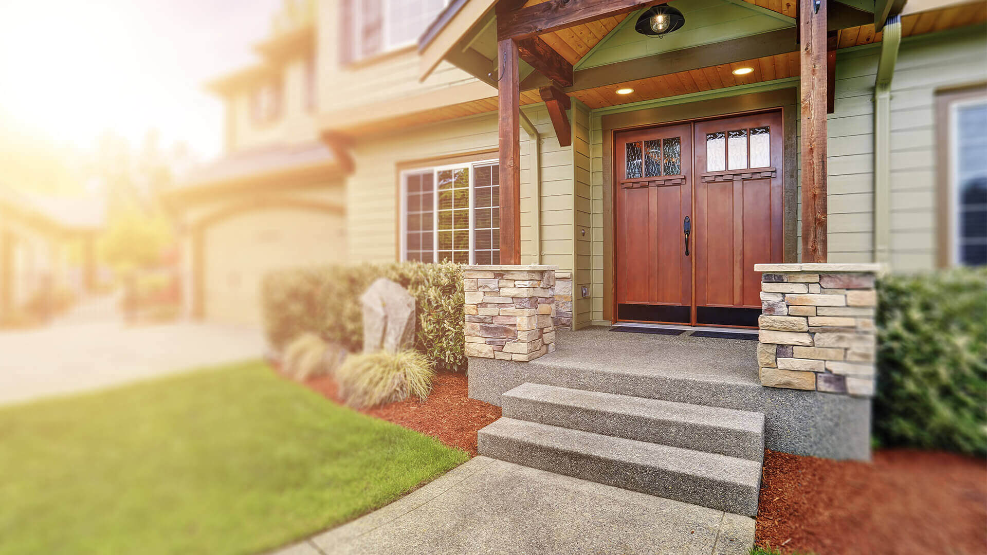 A wooden front entry door on a house.