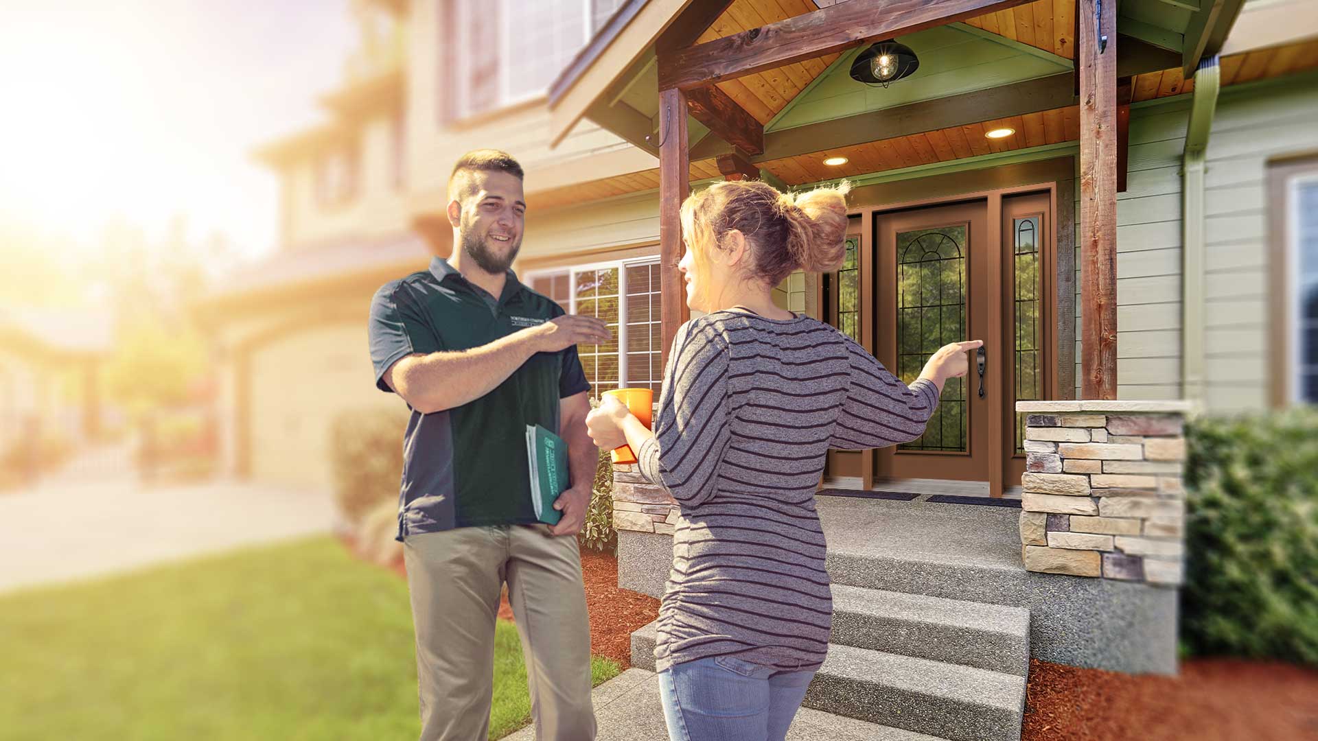 A Northern Comfort salesrep showing a customer some window options.