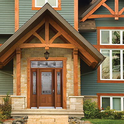 A modern light brown steel entry door