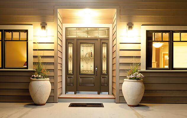 Chestnut fibreglass door with three-quarter glass insert, rectangular transom, and double sidelites