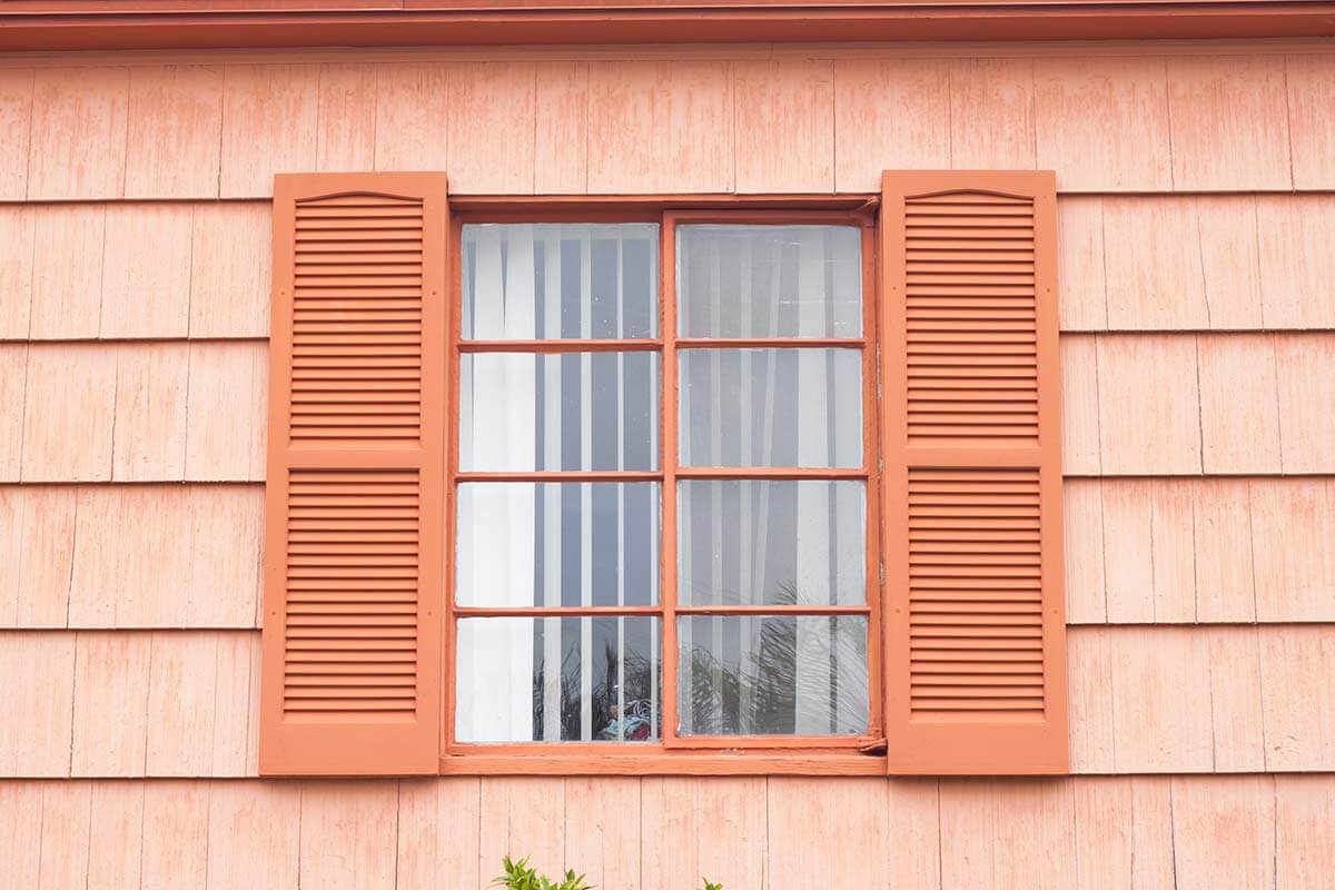 A set of window shutters on a house.