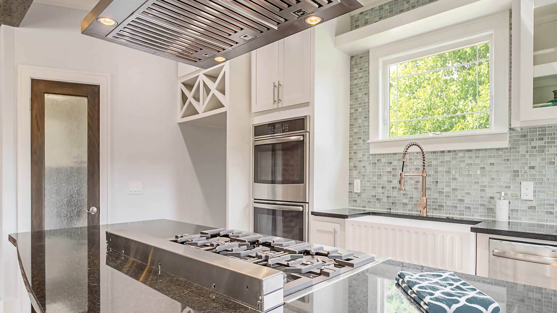 Modern renovated kitchen with a Classic Series Awning Window.