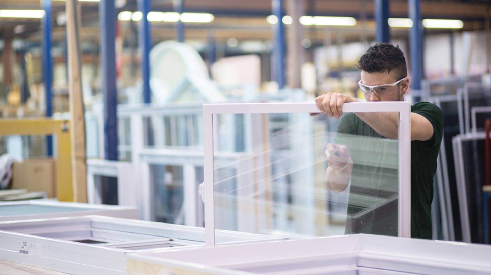 A Northern Comfort window builder working on the the factory floor.