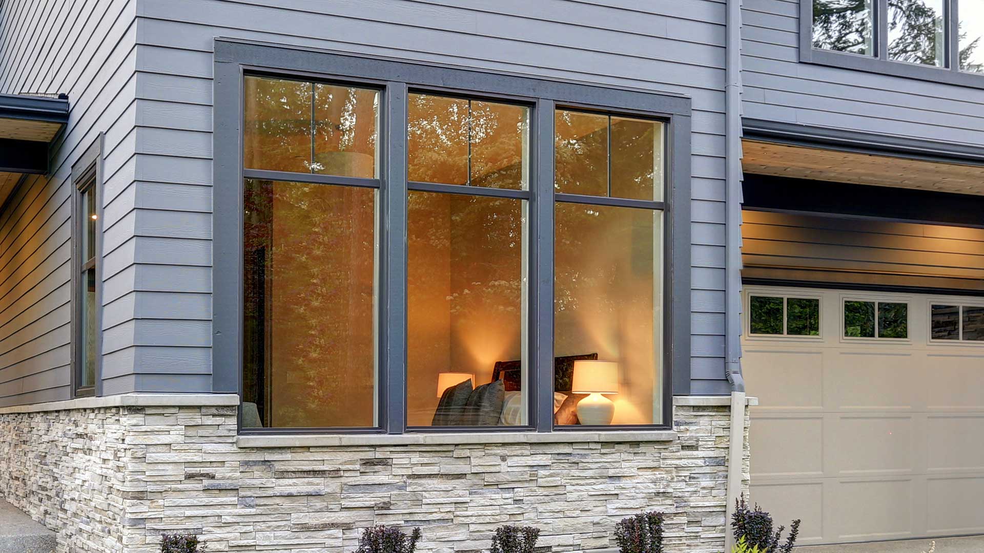 The front window of a house with coloured and textured window finishing.