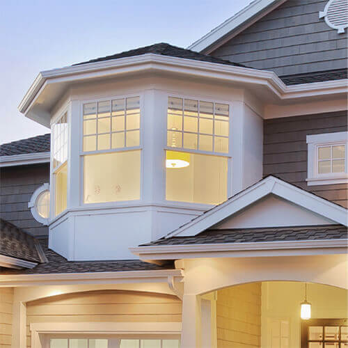 A Modern home with replacement, white vinyl windows