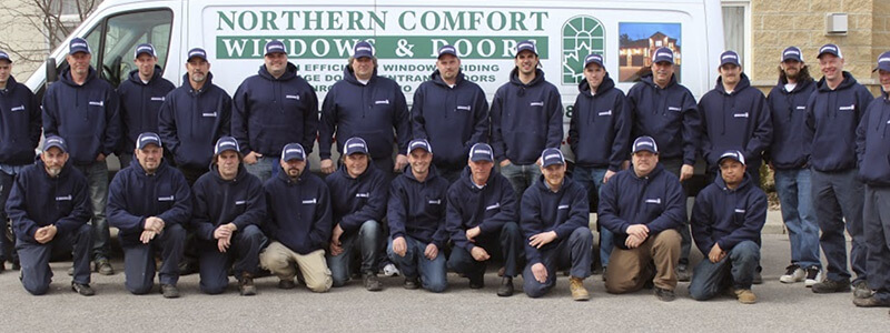 A large team of window and door installers.