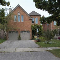 vintage home with two garage doors