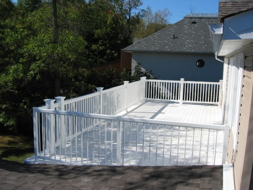 View from above white railing on upper deck