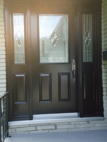 dark steel door with side windows