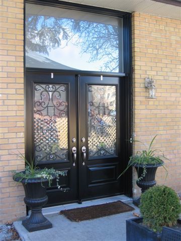 double steel entry doors with large window overhead