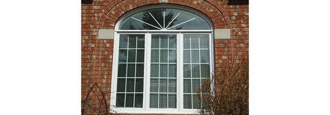 arched window on brick house