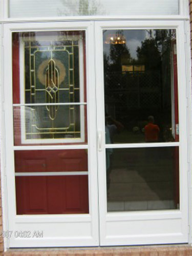 white storm doors over red entry door