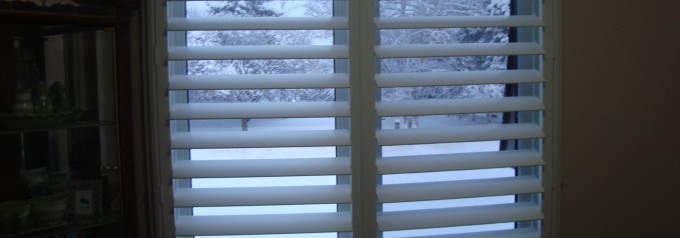 white shutters with snowy backdrop