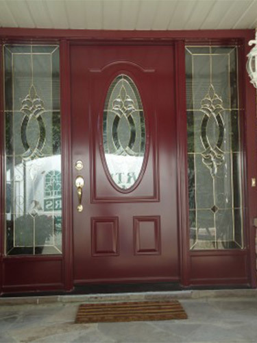 red steel door with ornate side windows