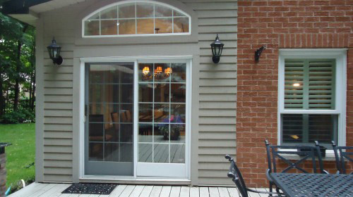 patio door with arched window above