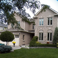 light tan home with tall thin windows